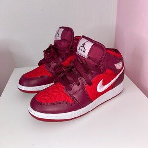 Air Jordan Jordan 1 Red and Burgundy Sneakers.